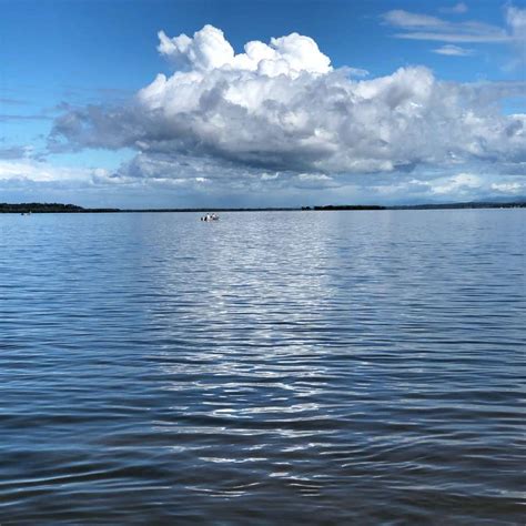 Blue Sea Under White Clouds And Blue Sky During Daytime Sliding