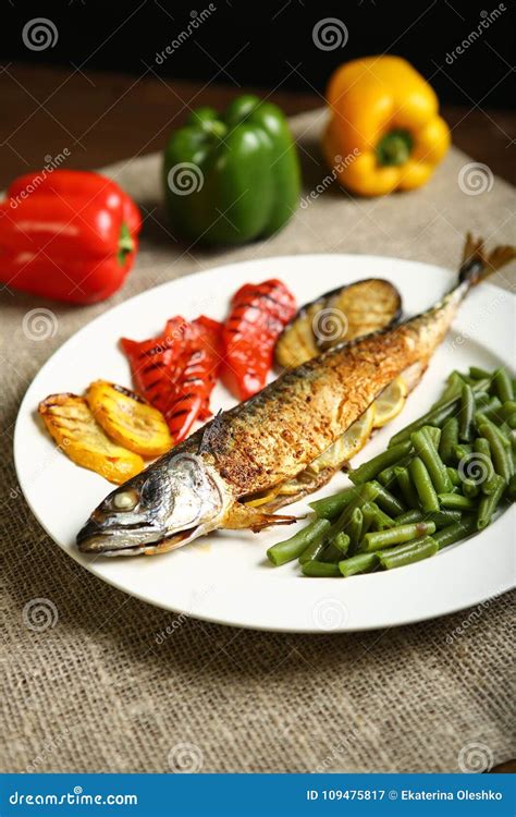 Healthy And Proper Food Grilled Fish And Vegetables Stock Image