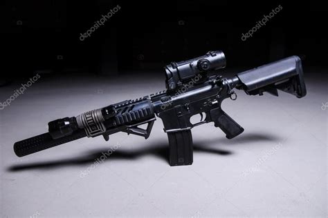 Automatic rifle with silencer and optical scop Stock Photo by ©Nesterenko_Max 101116392