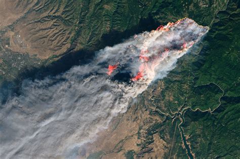 Fast Moving Wildfires Prompt Tens Of Thousands Of Evacuations In Both Northern And Southern