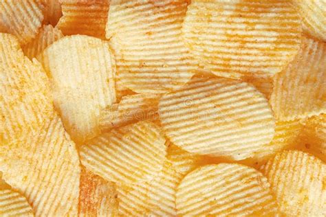 Potato Fluted Chips Close Up Background Of Corrugated Chips Top View