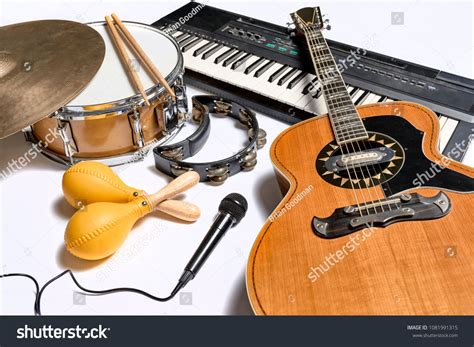 a group of musical instruments including a guitar, drum, keyboard ...