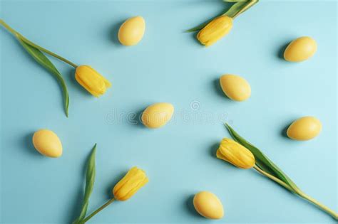 Yellow Tulip Flowers In Glass Vase And Wooden Toy Rabbit Easter