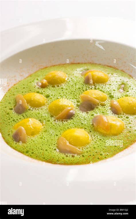 Ravioli With Buffalo Mozzarella Sarawak Pepper Clams In Parsley Sauce