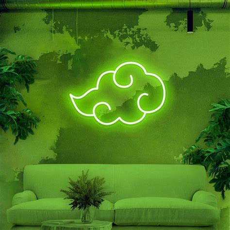 A Living Room With Green Walls And A White Couch In Front Of A Neon Sign