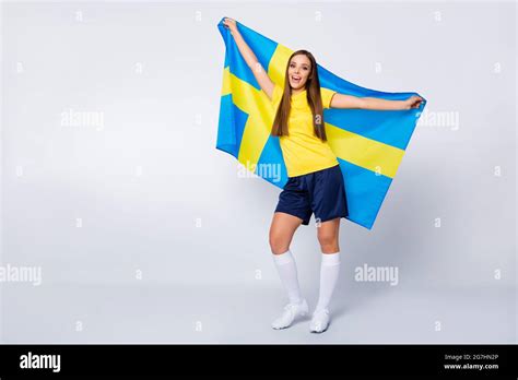 Full Length Photo Of Cheerful Football Fan Girl Hold Swedish Flag