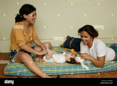 Two Young Women Changing Babys Diaper Asuncion Paraguay South