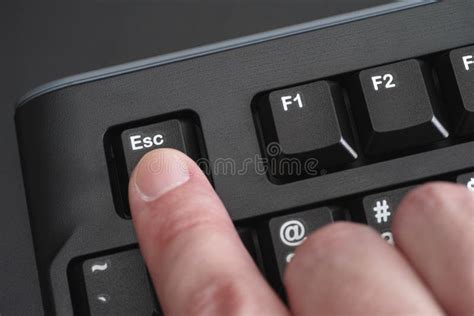 Finger Pushing Esc Key On Black Keyboard Stock Image - Image of ...