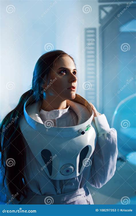 Portrait Of A Woman Astronaut In A Space Suit Dreamy Look Up