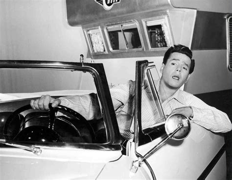 Desi Arnaz As Nicholas Carlos Collini In Car With Trailer In Background