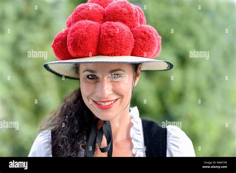 Attractive Young Woman Wearing A Traditional Black Forest Bollenhut