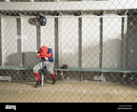 Sad Baseball Player Sitting In Dugout Stock Photo Alamy