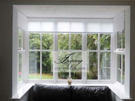 White Translucent Roller Blinds Fitted Into Square Bay Window