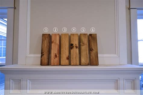 Four Pieces Of Wood Sitting On Top Of A Fireplace Mantel With Numbers