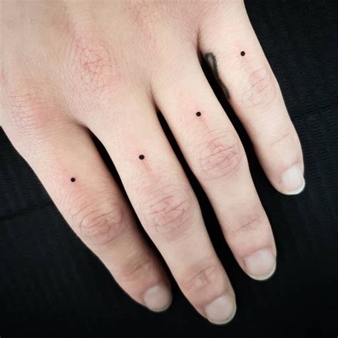 Black Symbol Tattoos On Fingers Tattoogrid Net