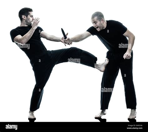 two caucasian men krav maga fighters fighting isolated silhouette on ...