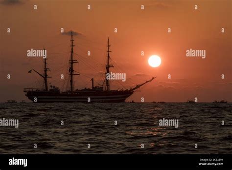 The Sunset Over The Sea Behind The Amerigo Vespucci Sailing Ship Near