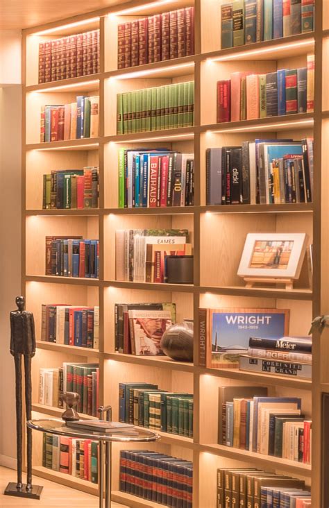 A Full Wall Of Shelving With Hidden Lighting Is A Bright Idea For This