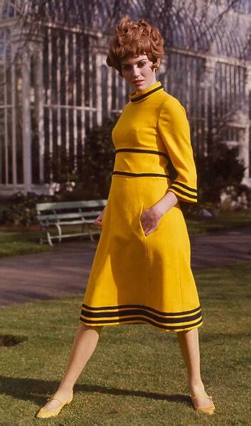 A Model Wearing A Yellow Tweed Maxi Dress Designed By Emor