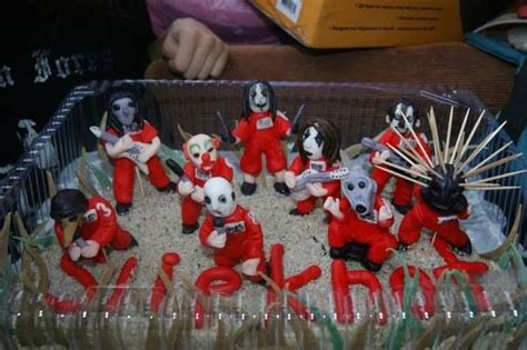 A Group Of Dolls Sitting On Top Of A Table