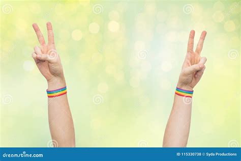 Hands With Gay Pride Rainbow Wristbands Make Peace Stock Photo Image