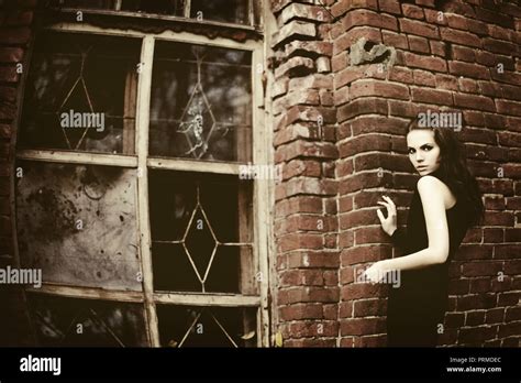 Brunette Girl At The Destroyed Brick Building Stock Photo Alamy