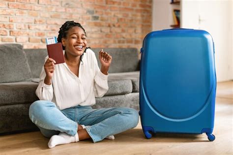 Premium Photo Excited African American Female Tourist With Passport