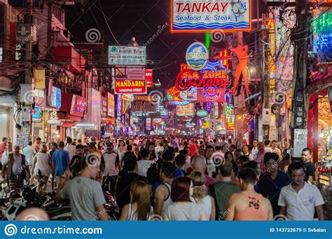 Tourists Walk At Night Along The Walking Street In Pattaya Editorial