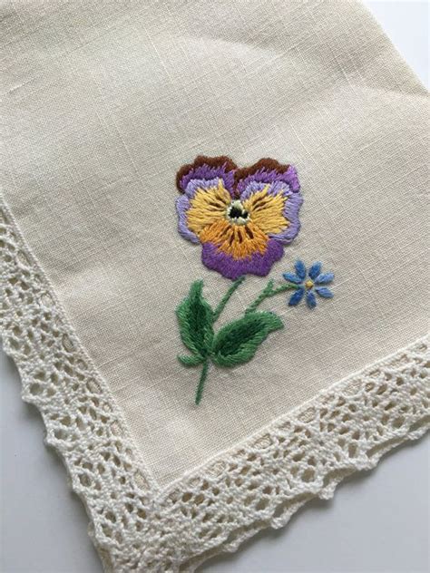 A Close Up Of A Piece Of Cloth With Flowers On It