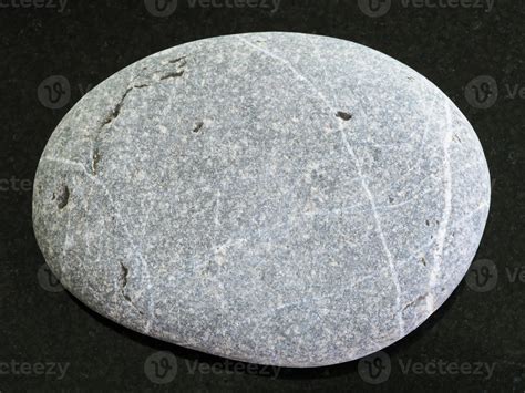 Tumbled Graywacke Sandstone On Dark Background Stock Photo At