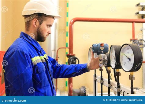 Inspector Checking Pressure Gauges On Heating Boiler System Stock Image