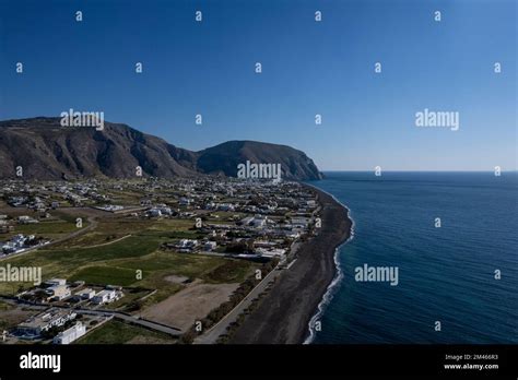 An aerial view of Santorini island surrounded by buildings Stock Photo ...