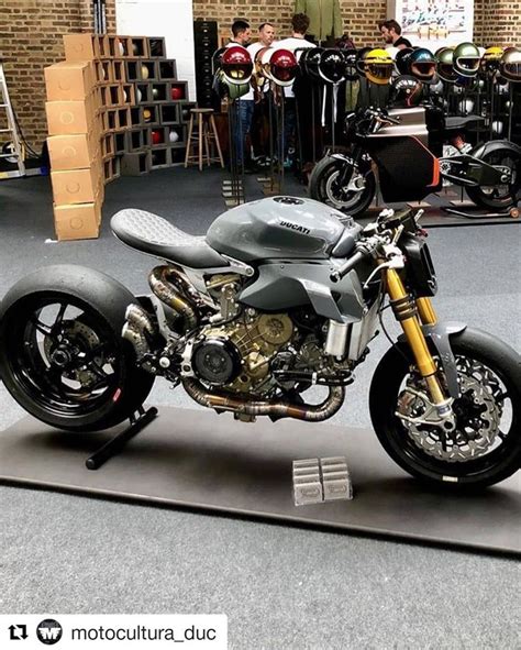 A Motorcycle Is On Display In A Showroom