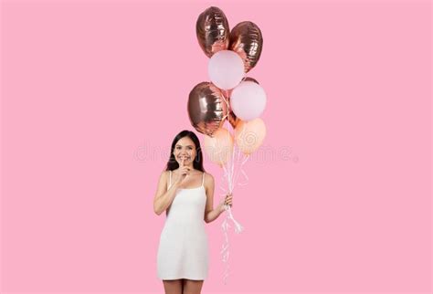 Smiling Woman Holding Festive Balloons On Pink Background Stock Image Image Of Brunette