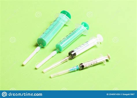 Top View Of Medical Syringes On Colorful Background Health Care