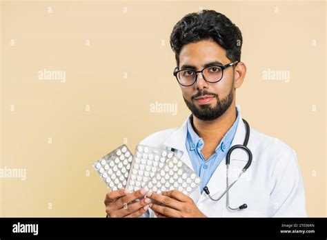 Indian Doctor Cardiologist Man Shows Lot Of Tablet Pills In Blisters Recommends Drugs Vitamin