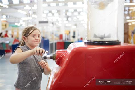 girl playing  interactive exhibit  science center science
