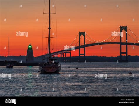 Goat Island Lighthouse And The Jamestown Or Pell Bridge At Sunset