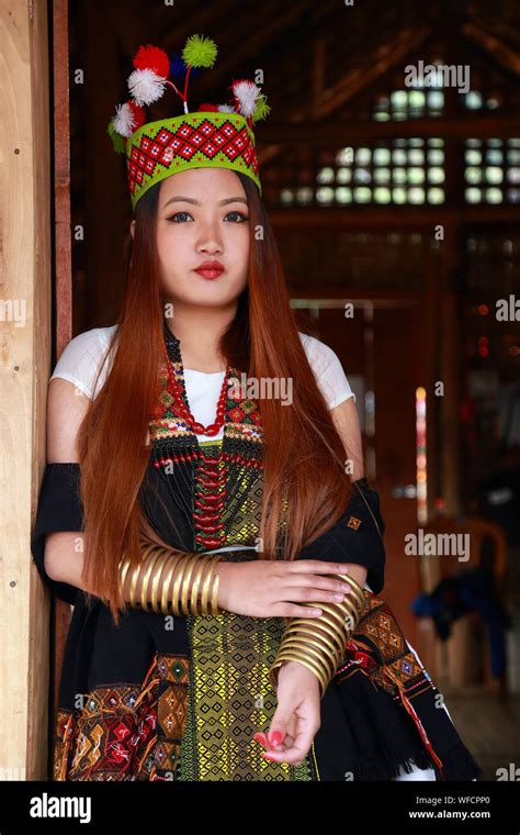 Beautiful Kuki Tribes Lady In Front Of Their Traditional House At