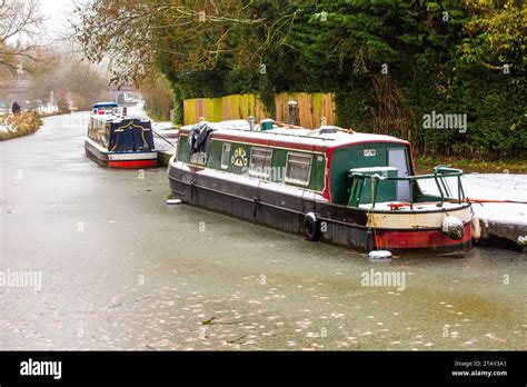 Canal Narrowboat Moored On The Trent And Mersey Canal In The Snow