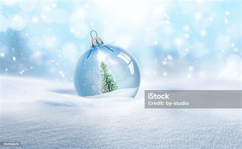 Transparent Glass Christmas Ball In Snow Stock Photo Download Image