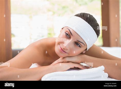 Beautiful Smiling Brunette Lying On Massage Table Stock Photo Alamy