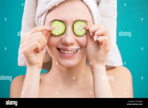 Cheerful Beautiful Woman With A Towel Wrapped Around Her Head Covering