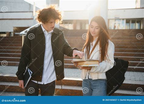 Front View of Two Students Walking and Talking in an University Campus. Stock Image - Image of ...