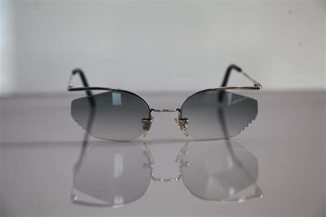 Vintage 90s Nigura Sunglasses Chrome Rimless Frame Blue Gray Lenses