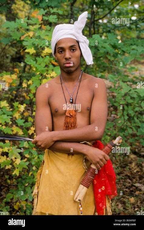 Young Cherokee Man Dressed In Traditional Buckskin Leggings And