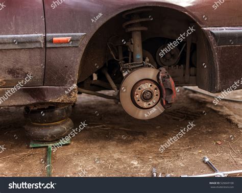 Passenger Car Removal Wheels On Hydraulic Stock Photo 520669108