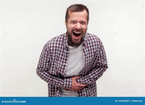 Portrait Of Extremely Excited Happy Bearded Man Holding His Belly And