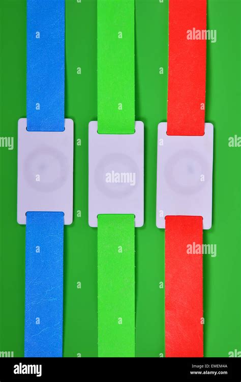 Color Rfid Id Bracelets On A Green Background Stock Photo Alamy