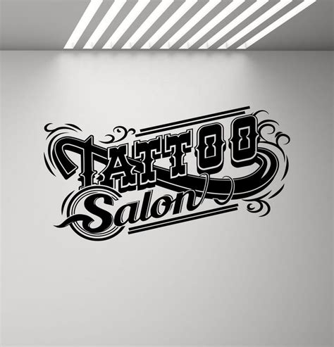 The Logo For Tattoo Salon Is Shown In Black And White With An Artistic